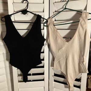 NWOT Dynamite body suits size L . Includes both